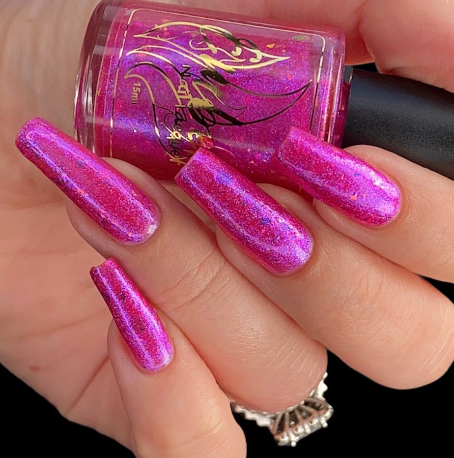 Patty's Peach base is an  intense shade of fuchsia with interesting shimmers and holographic flakes of blue and orange