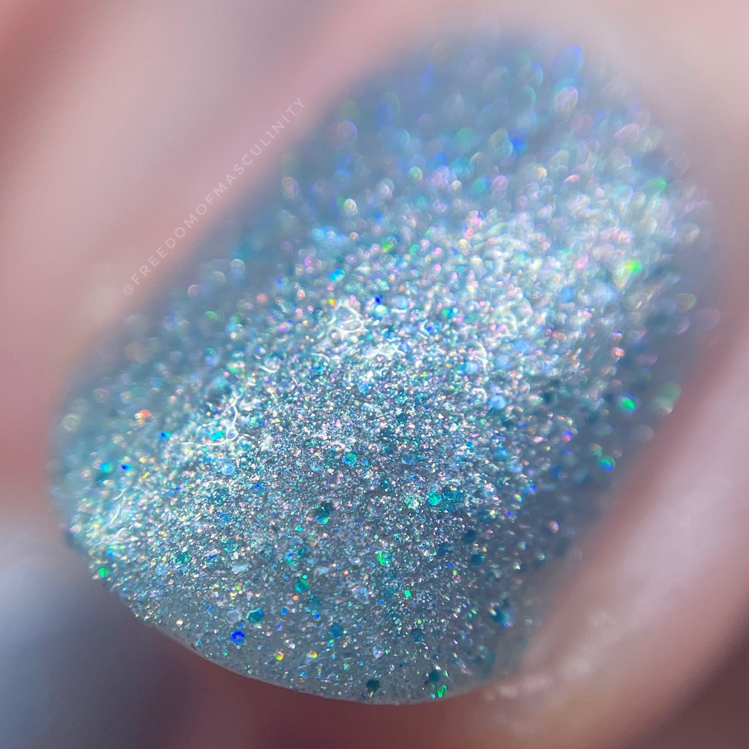 extreme closeup of Watch This blue base coat and pink shimmer
